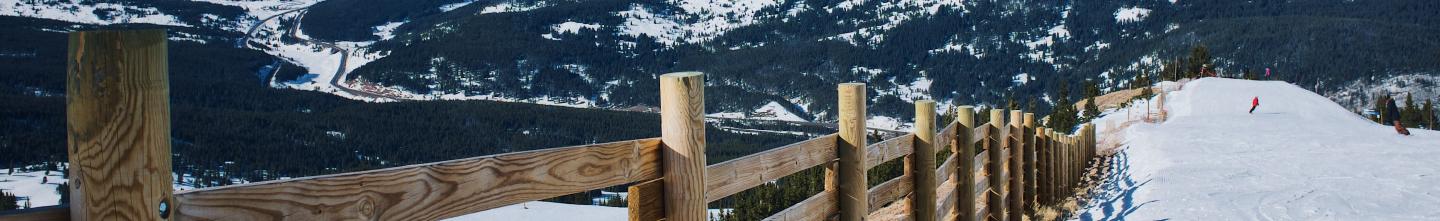 snowy landscape of mountain and fence