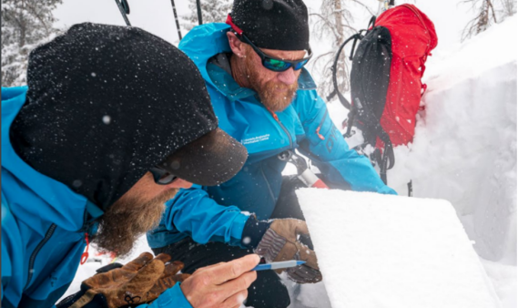 forecasters working in snowpit