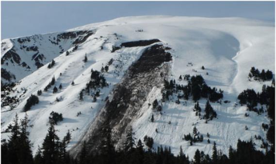 This Glide Avalanche broke to the ground on a smooth, grassy slope. From all the mud on the bed surface, water pooling at the base of the snowpack likely caused the failure.