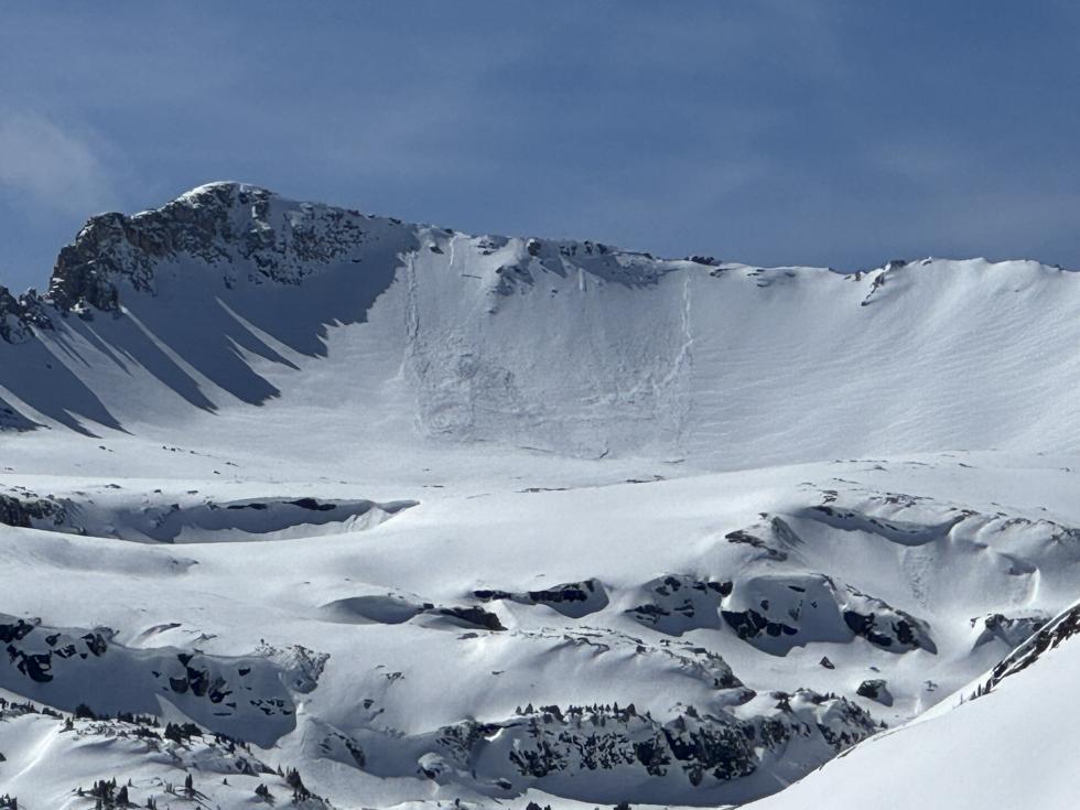 Looking at an avalanche on a steep slope in the distance